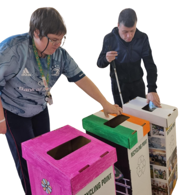an image of two people with d.i.y recycling bins