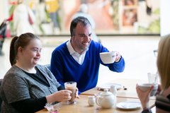 Two Adults Socialising and Relaxing over Coffee